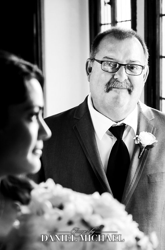 a dad Watching Bride before she Walks Down Aisle